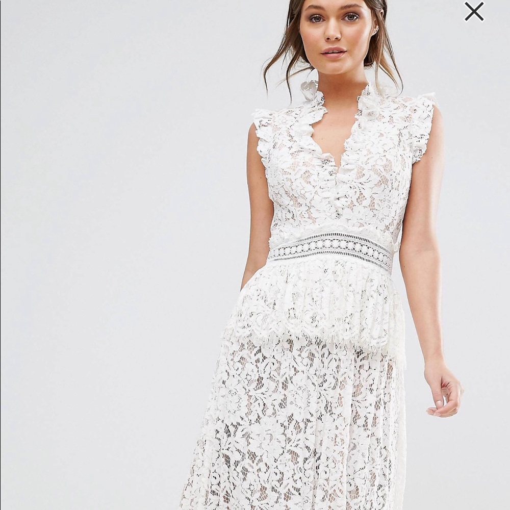 True decadence lace dress with ruffle neck.